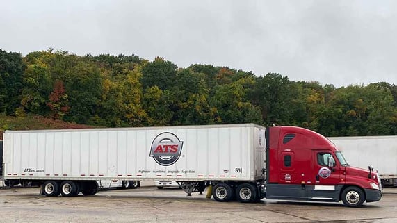 Dry-van-in-front-of-trees-2