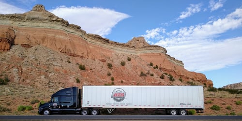 Dry van parked on side of desert highway