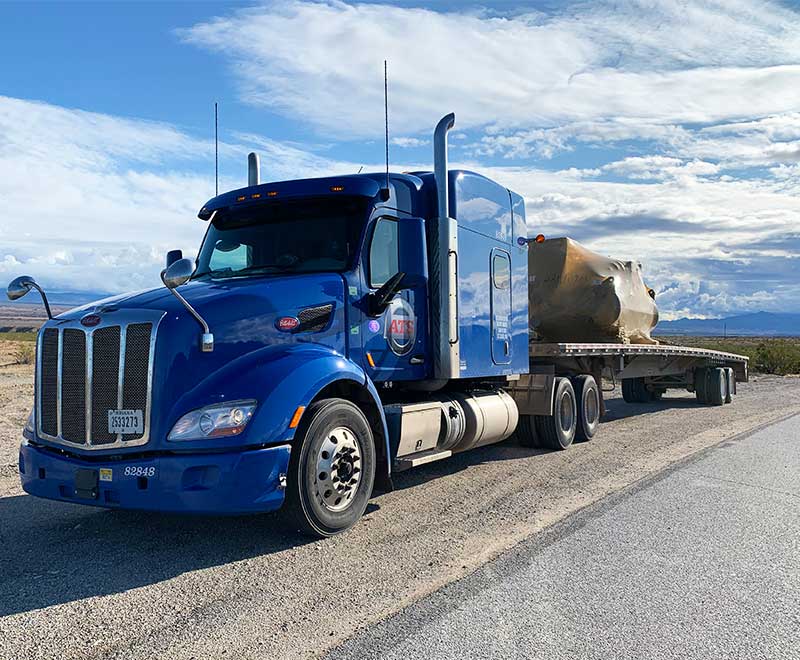 Flatbed trailer with tarped load