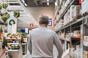 Man Shopping During Holiday Season in Retail Store