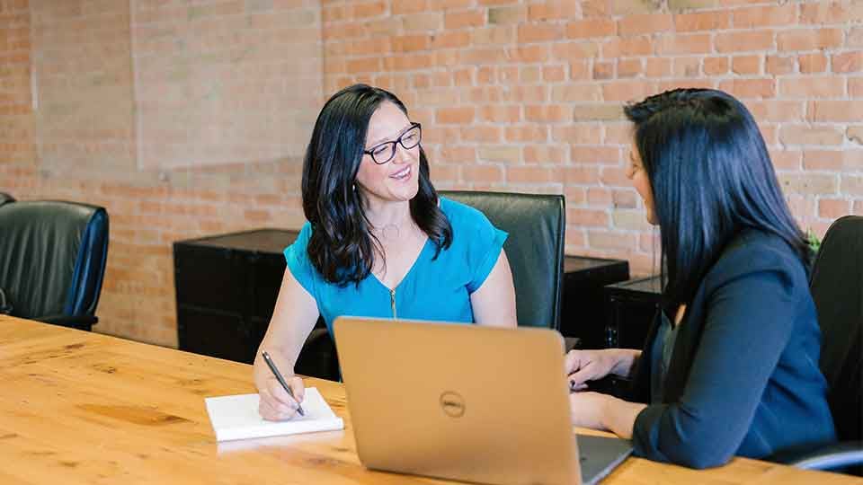 People sitting at table during job interview