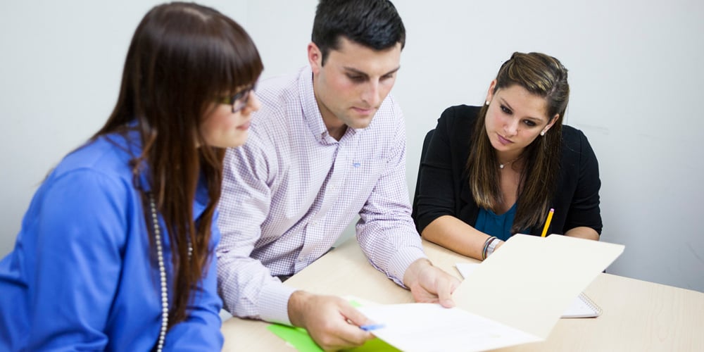 Three employees meeting in a conference room