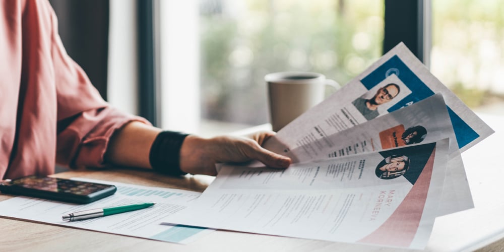 Woman-looking-at-resumes