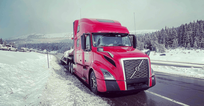 Semi-Truck-Stopped-on-Snowy-Highway