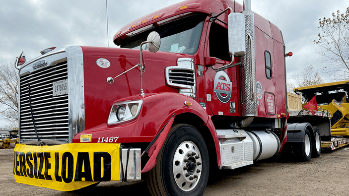Oversized-load-tractor-with-flags