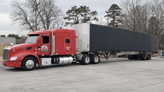 An example of a Conestoga trailer hauled by an ATS truck