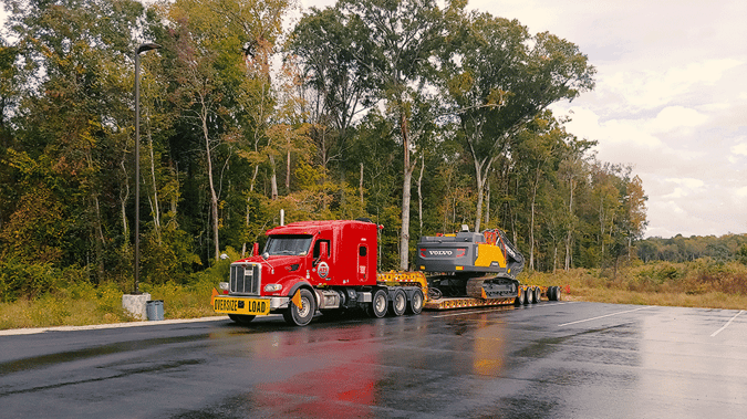 lowboy-trailer-moving-digger