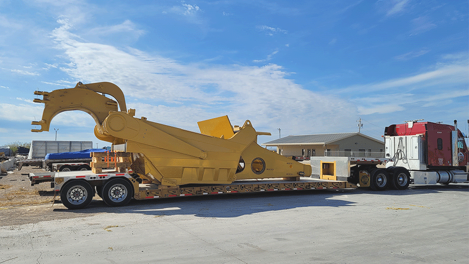 Machine-part-on-double-drop-trailer