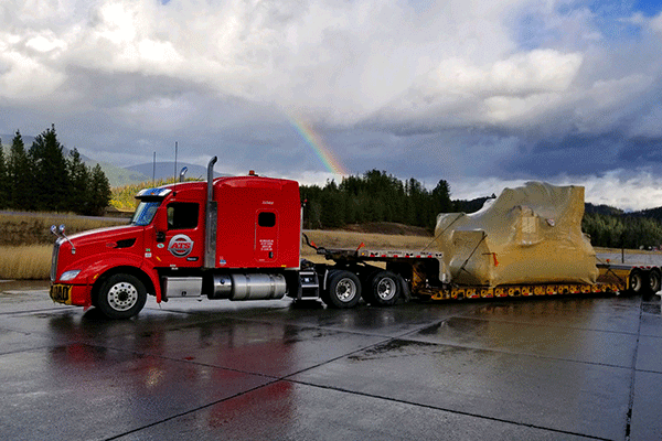 Lowboy trailer hauling freight