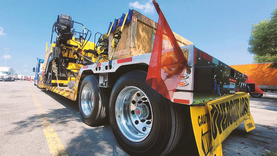 oversize load on lowboy trailer