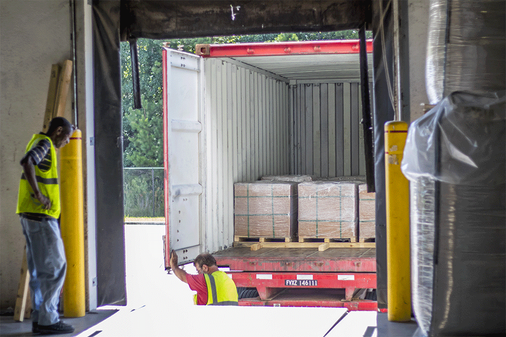 A shipment is unloaded at a warehouse