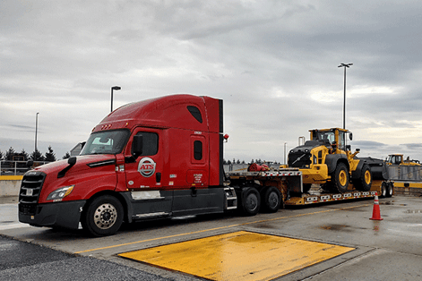 step-deck-heavy-equipment-shipment