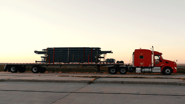 Flatbed-hauling-steel-i-beams